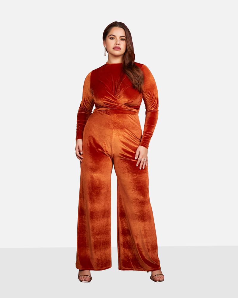 Front of a model wearing a size 3X Cynthia Velvet Twisted Front Wide Leg Jumpsuit - Cinnamon in Brown by Rebdolls. | dia_product_style_image_id:324251